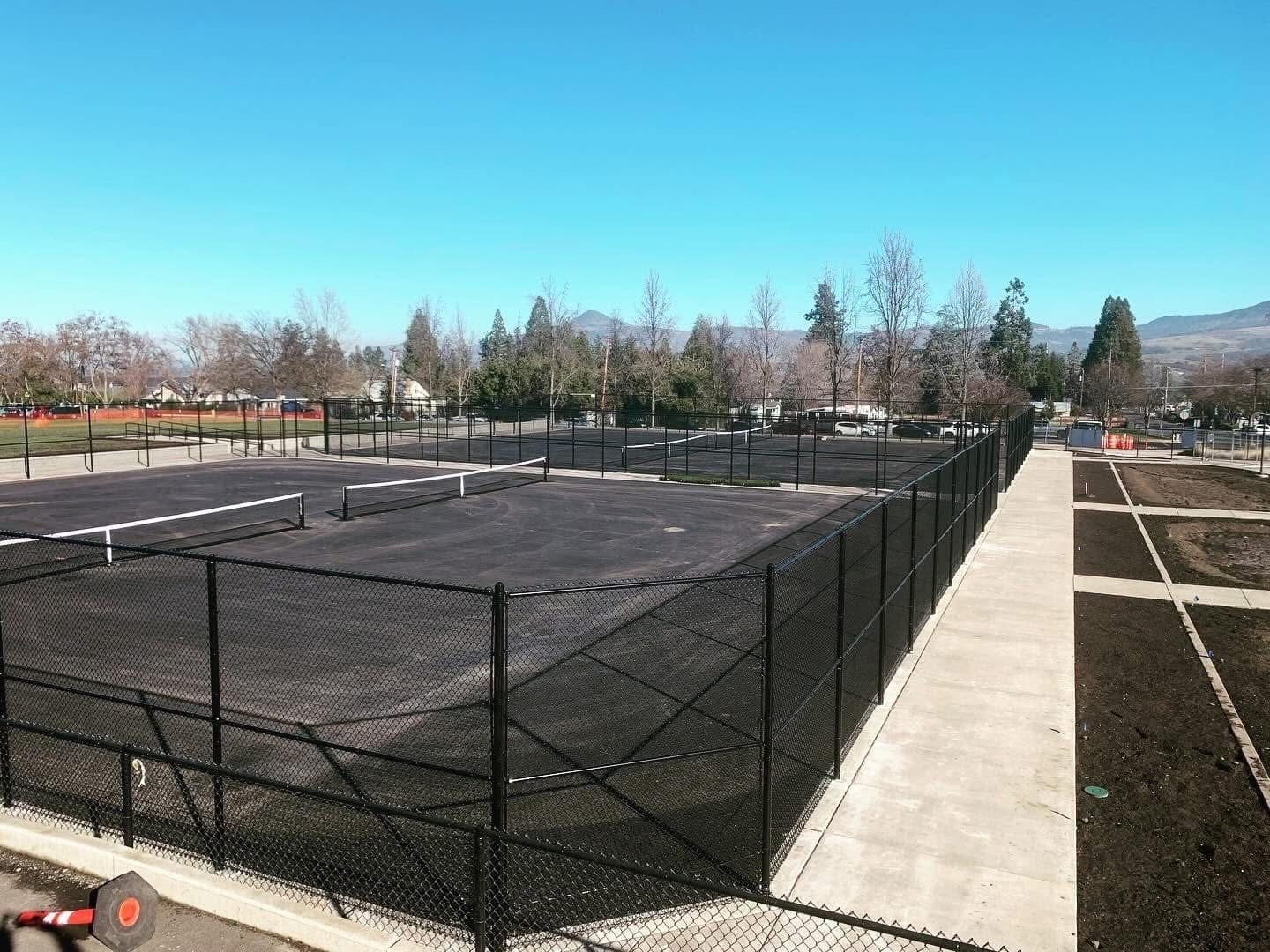 Ten foot high tennis court fencing at Phoenix High School in Phoenix, Oregon