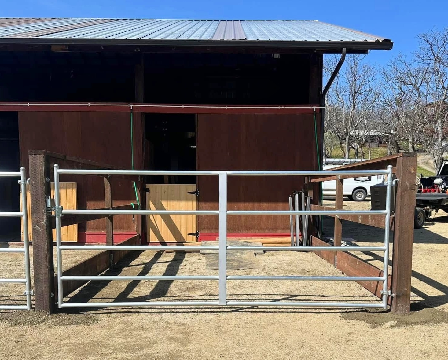 Three rail pressure treated horse corral with custom gates near Eagle Point, Oregon