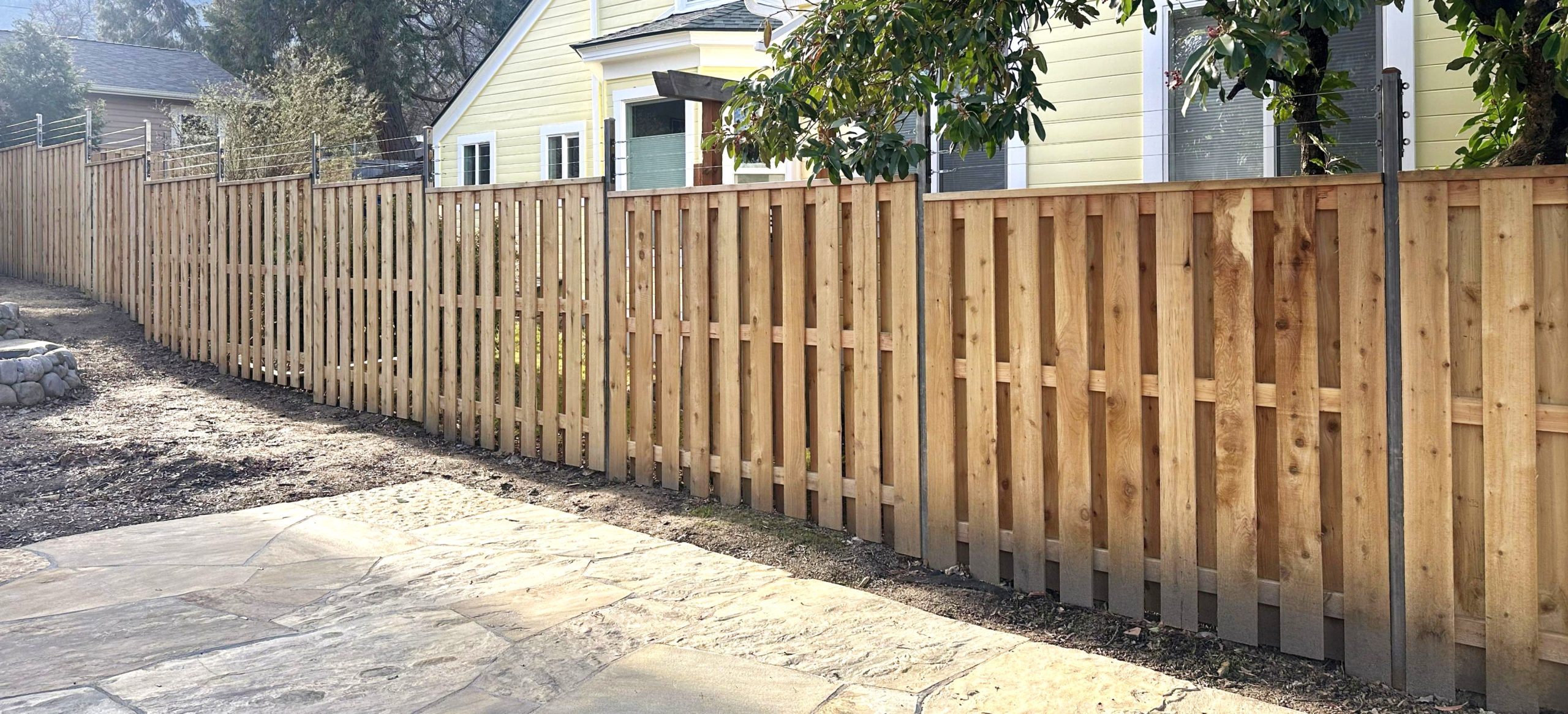 Shadowbox Cedar fence with smooth wire deer protection strands near Ashland, Oregon