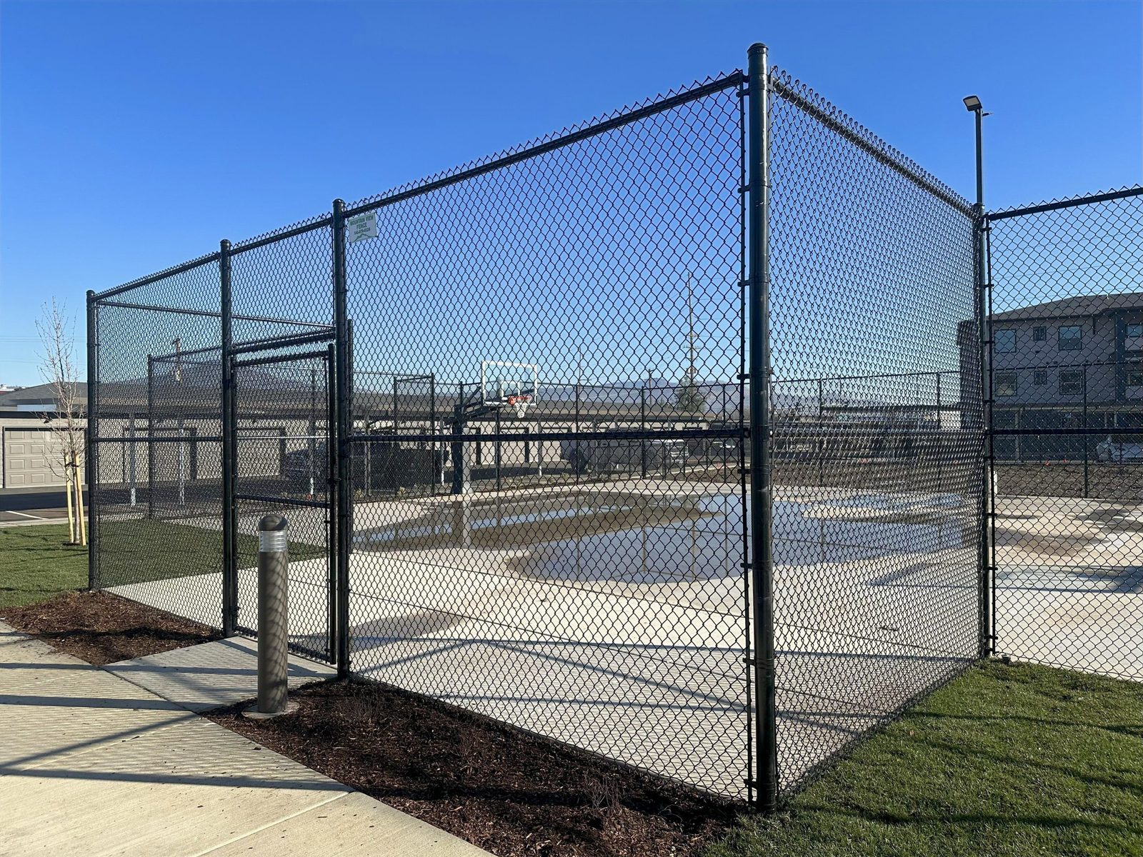 10' High All Black Chain Link Fence For a Basketball Court