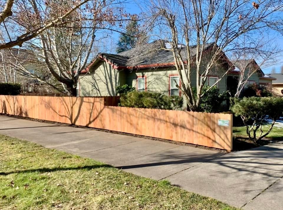 4' Dog Eared Cedar Fencing Transitioning to 3' Dog Eared Cedar Fence