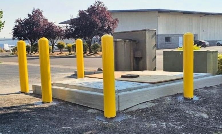 4' High Concrete Bollards with Safety Yellow Sleeves