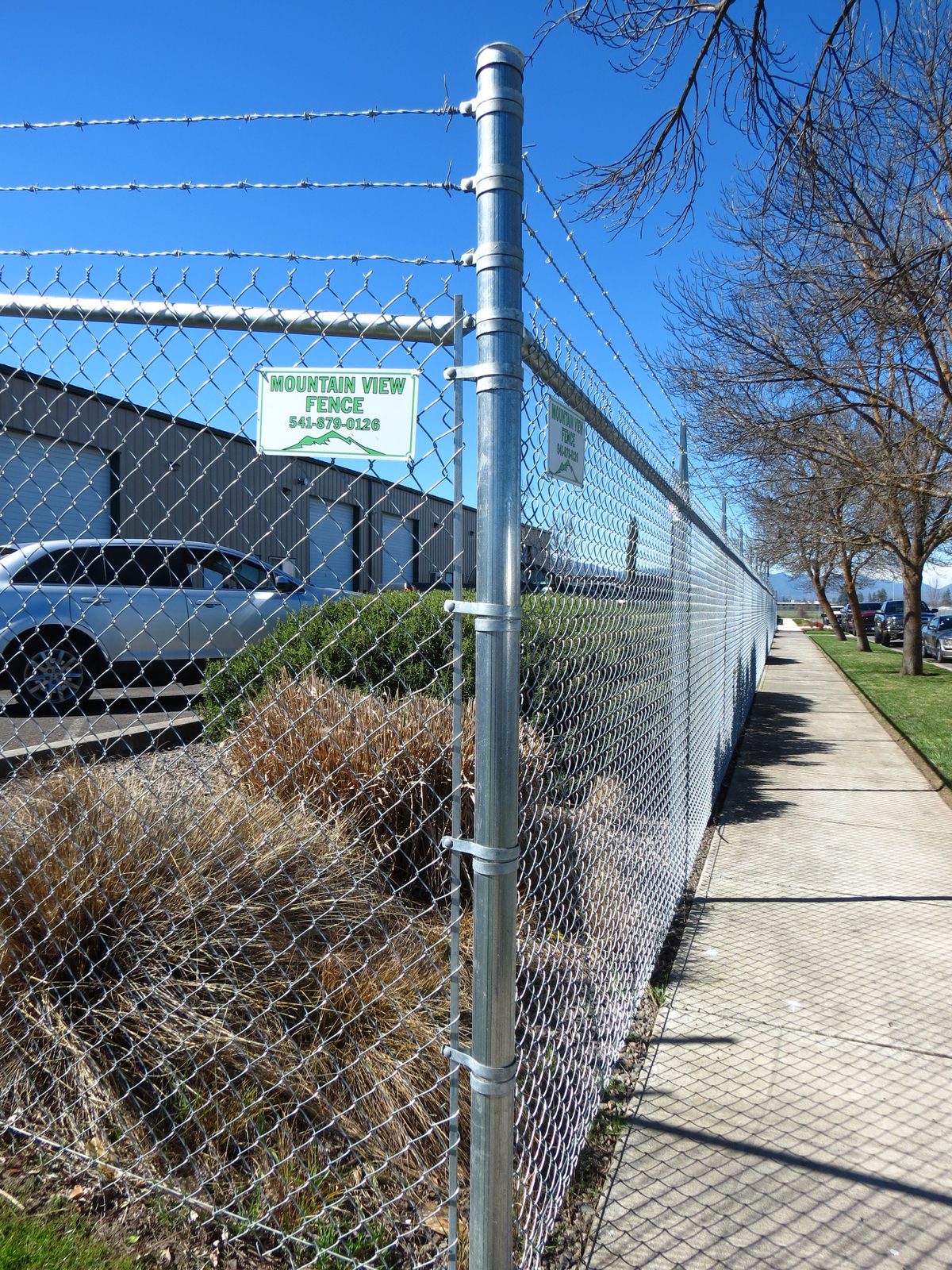 6' High Chain Link Fence with 3 Strands Barbed Wire on Top