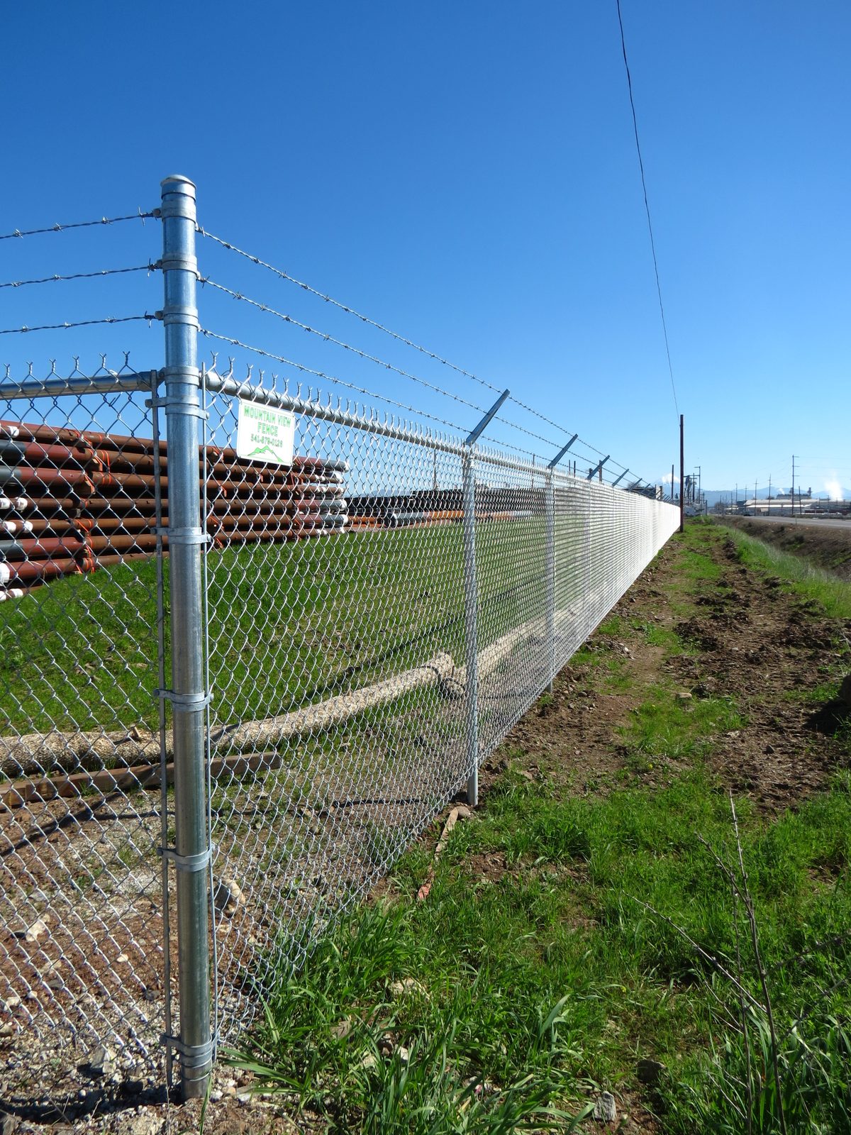 6' High Chain Link Fence with 3 Strands Barbed Wire on Top at 45 Degree Angle