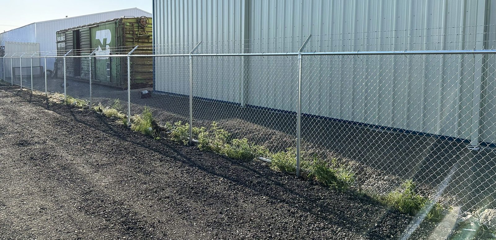 6' High Chain Link Fence with Angled 3 Strands of Barbed Wire on Top
