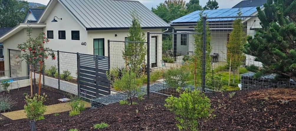 7' High 4" x 4" Bare Steel Grid Fencing with Steel Flat Bar Privacy Panels