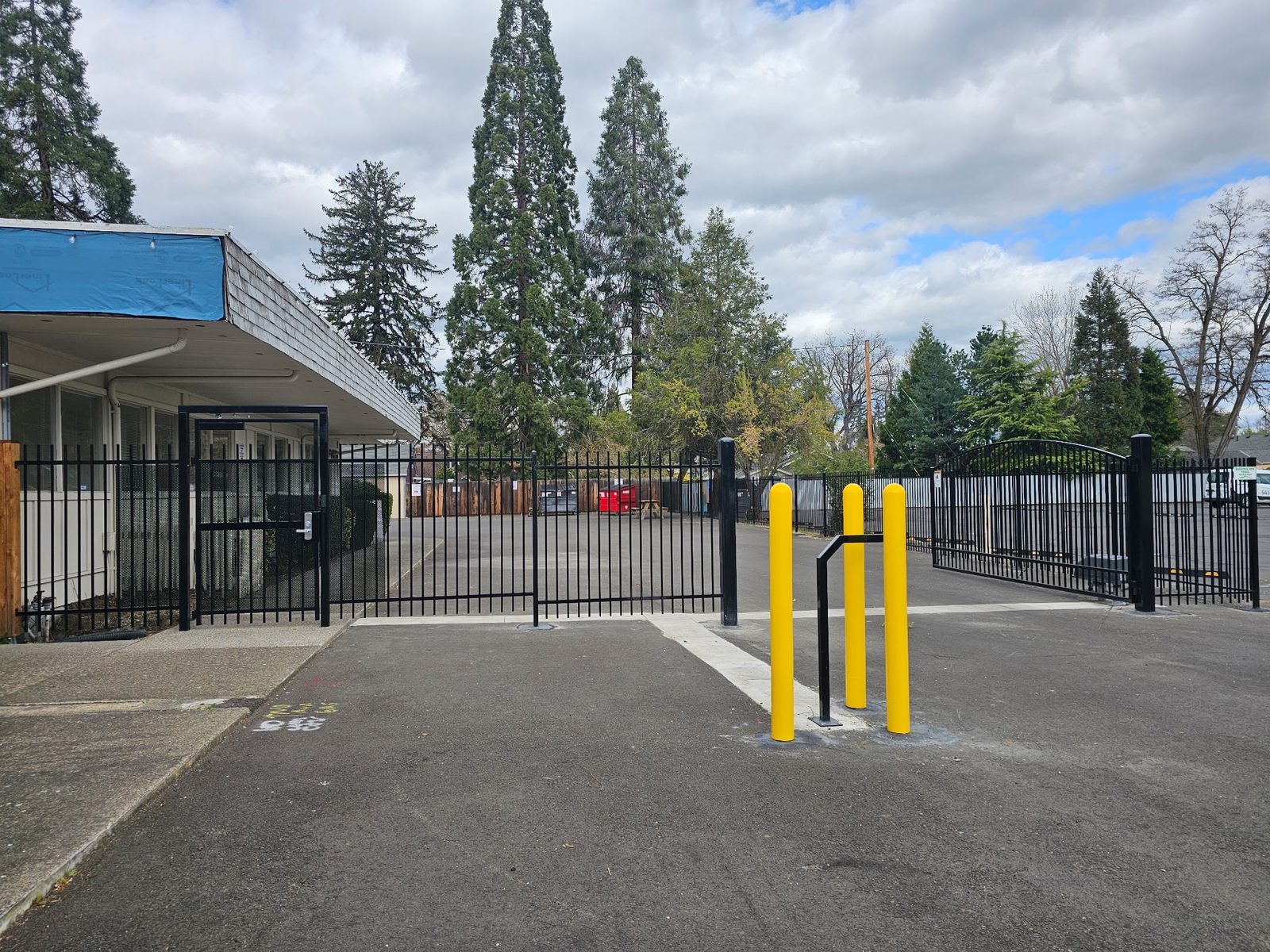 Bollards with Safety Yellow PVC Sleeves to Protect Keypad
