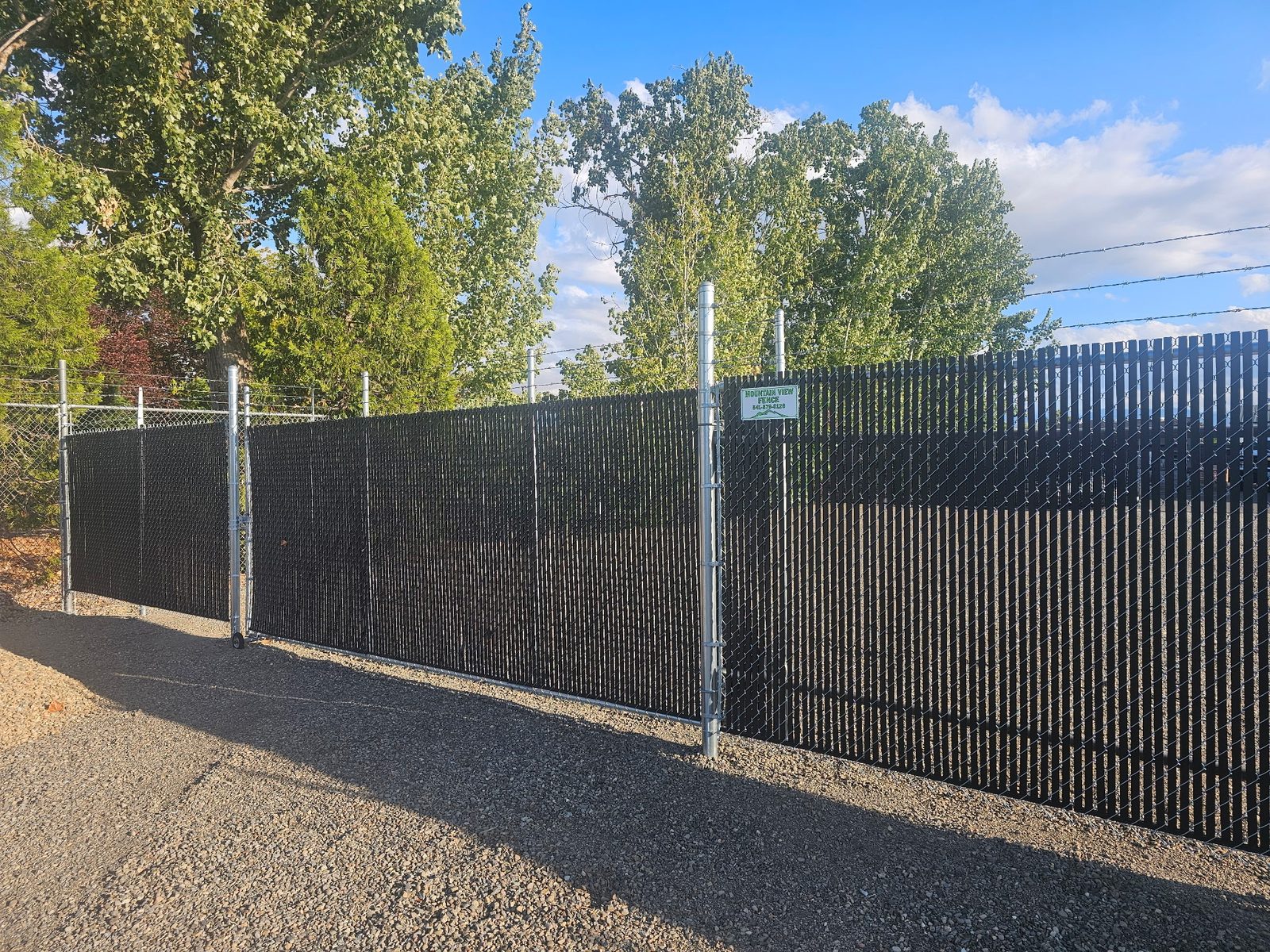 Chain Link Security Fence with Black Privacy Slats