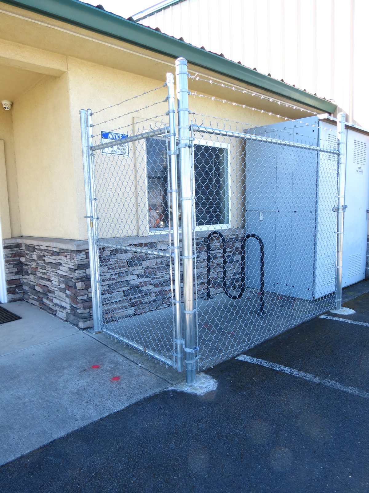 Custom Bike Rack Enclosure 6' High Chain Link Fencing with 3 Strands Barbed Wire on Top