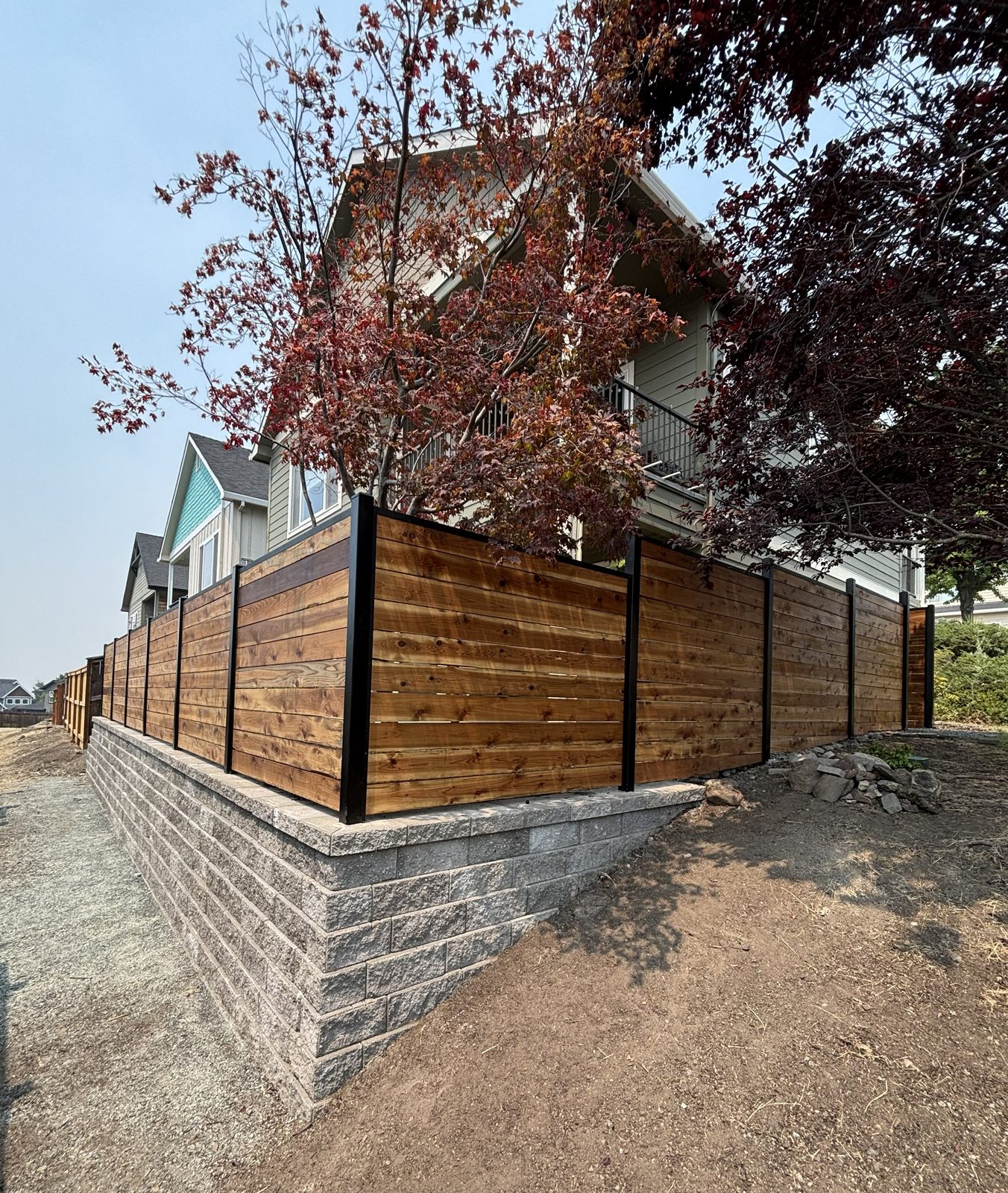 Stained Horizontal Board Fence with Black Powder Coated Steel Posts